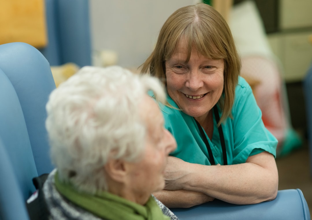 Caregiver smiling with an older adult